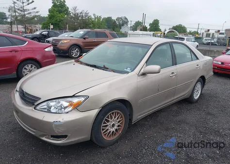 2003 Toyota Camry Le z USA, uszkodzony, nr VIN 4T1BE32K63U127628